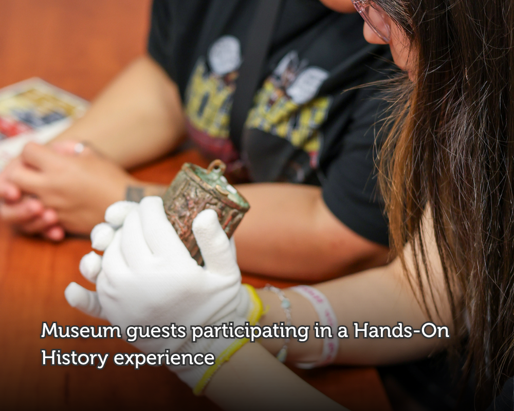 Photo_of_Museum_guests_participating_in_a_Hands-On_History_experience.png
