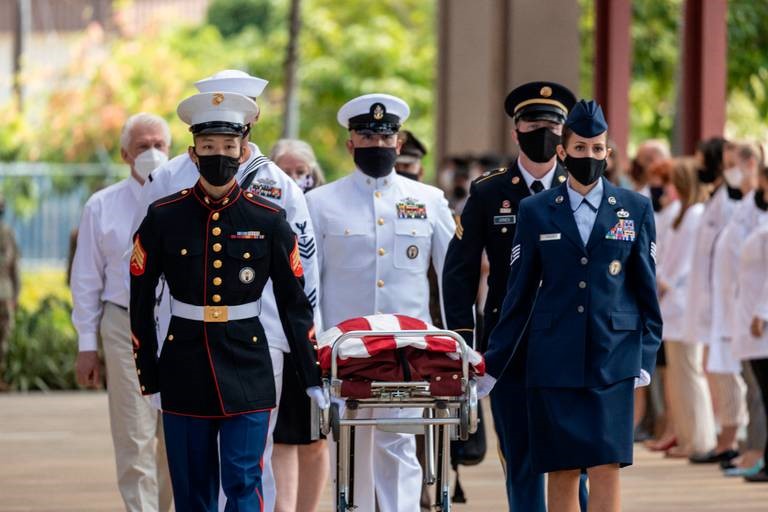 Members of all branches of the US Armed Forces escort the remains of Fr. Emil Kapaun in Hawaii
